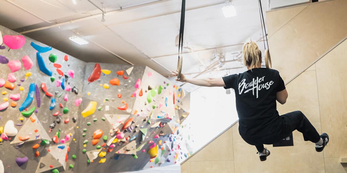 A person bouldering at the Boulder House in Victoria's Midtown.