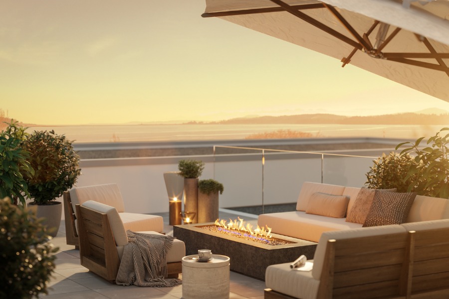 The Rise on Fifth's rendering of a patio with comfortable seating, a linear fire pit, an umbrella, all overlooking the ocean.